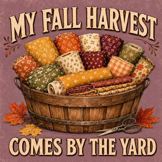 Vintage-style autumn graphic with the words “MY FALL HARVEST” at the top and “COMES BY THE YARD” at the bottom. A wooden basket filled with rolled fabric in fall colors sits on a mauve background with orange leaves and scissors.